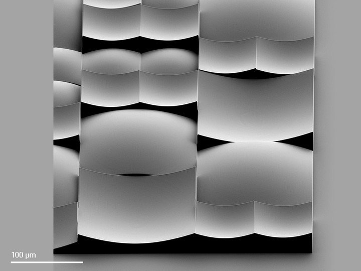 Innovative random microlens array containing convex and concave lenses