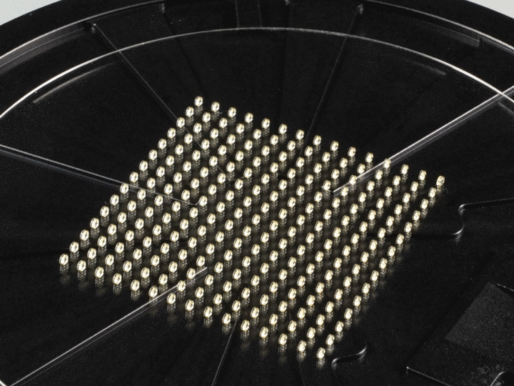 GIF of 225 double-sided aspherical lenses on a wafer and close-up
